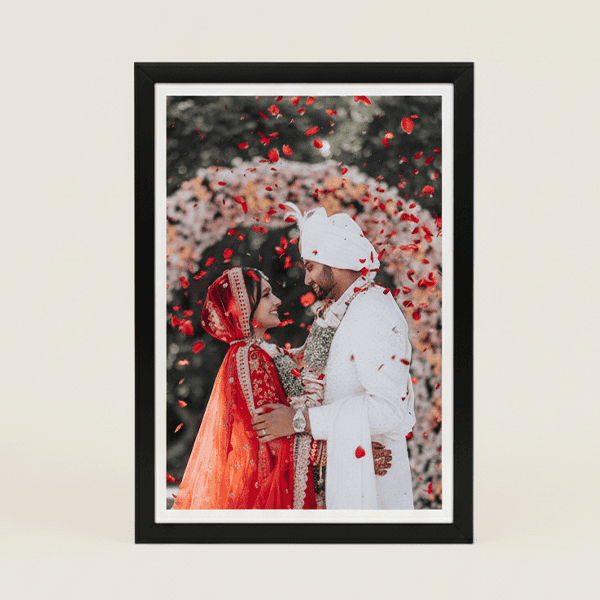 Elegant wedding photo frame with couple in traditional attire. Perfect for custom printing and gifti.