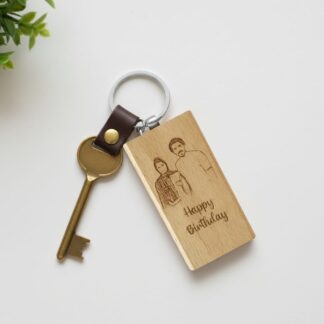 Custom engraved wooden keyring with photo and "Happy Birthday" message.