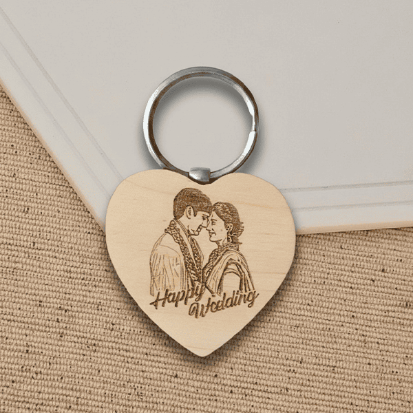Engraved wooden keychain with a couple's portrait and "Happy Wedding" message. Perfect personalized.