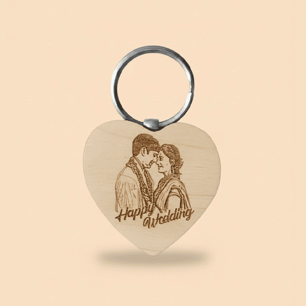 Engraved wooden keychain with couple's portrait and "Happy Anniversary" text.