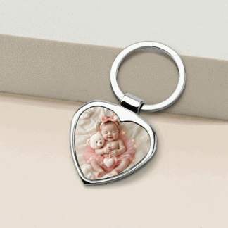 Personalized heart-shaped metal keychain featuring a baby photo for a special gift.