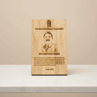 Personalized wooden photo frame with engraved portrait and text.