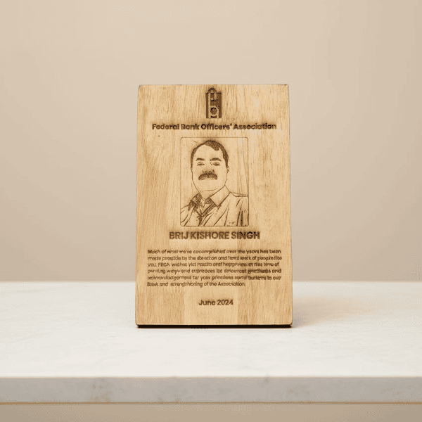 Personalized wooden photo frame with engraved portrait and text.