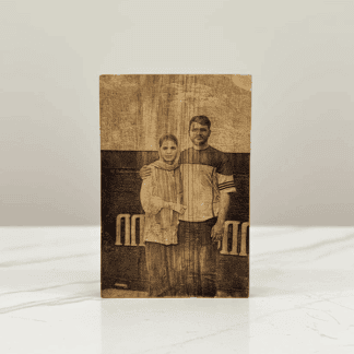 Engraved wooden photo frame featuring a personalized couple portrait, perfect for commemorating spec.